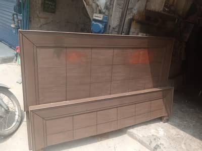 wooden bed in good condition