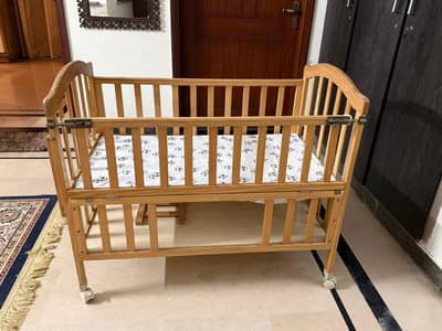 Baby wooden cot available in 10/10 condition.