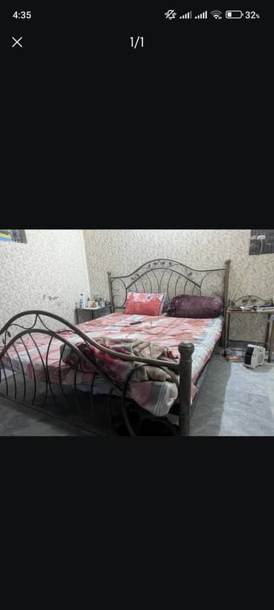 bed with two side tables and mattres