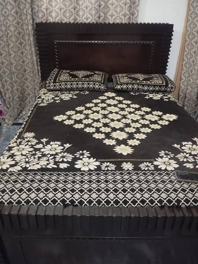 Queen size bed with mattress.