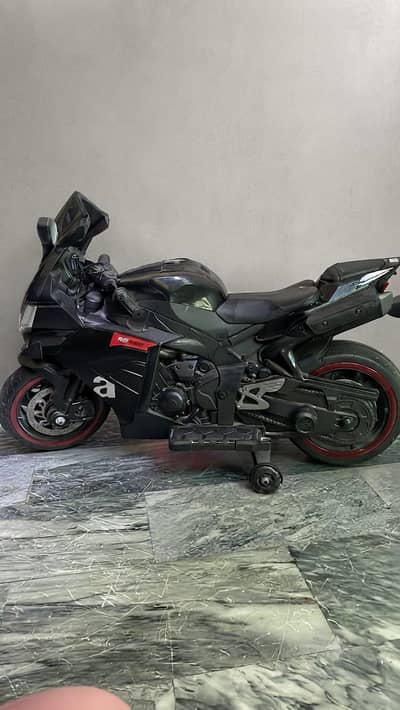 Aprilia RS 660 style rechargeable bike for kids with music and lights