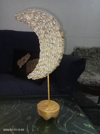 Moon stand decorations made with date seeds