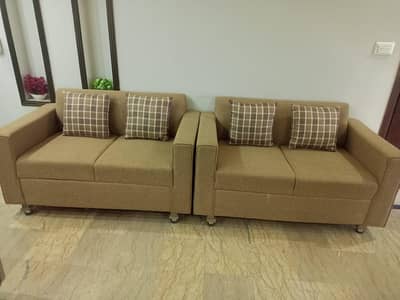 2 Sofa set with brown cushions for sale