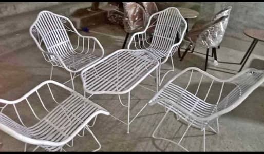 4 chair's with table . heavy guage iron