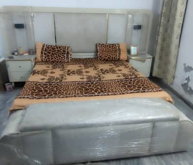 king size bed with side tables and dressing and fixed setty