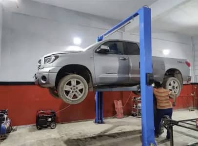 Car two post lift clear floor .