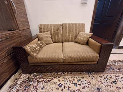 solid wood 2 seater sofa,  like new.
