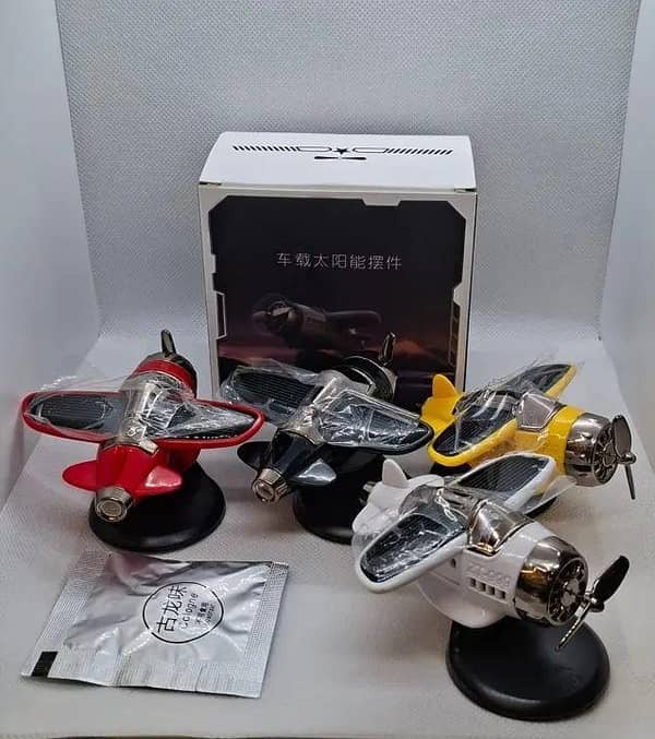 CAR DASHBOARD SOLAR AIRPLANE AIR FRESHENER ROTATING IN 4 DIFFERENT COLOURS RED BLACK WHITE YELLOW