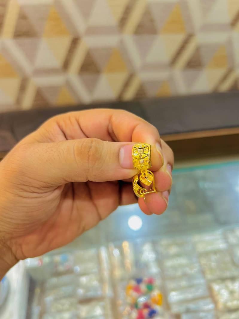 gold earering 0