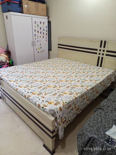 double bed with cupboard