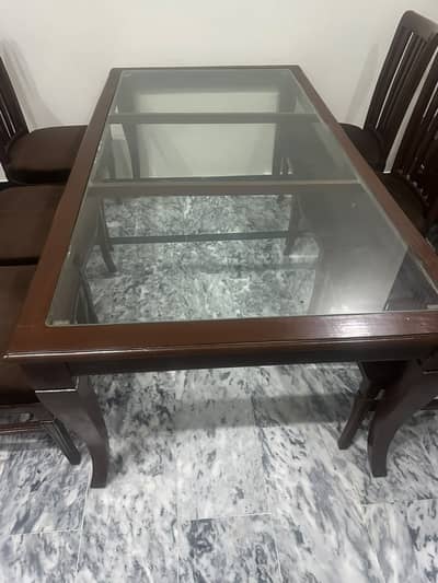 Dining Table with 8 chairs along with chair covers for sale.