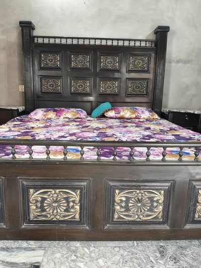 wooden double bed with side tables