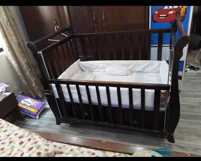 baby coat in wooden