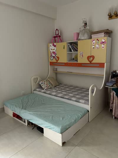 Kids bed with attached cupboards
