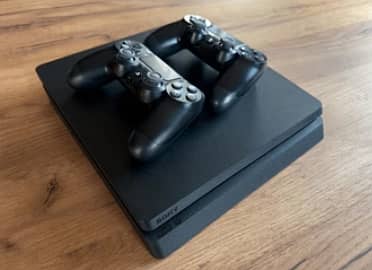 Play Station 4 Slim 1TB with two controller and two CDs