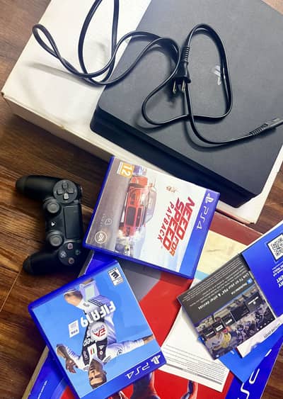 Sony PlayStation 4 Slim (PS4 Slim) with accessories and box