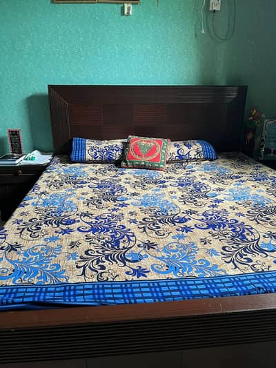 bed with two side tables and dressing