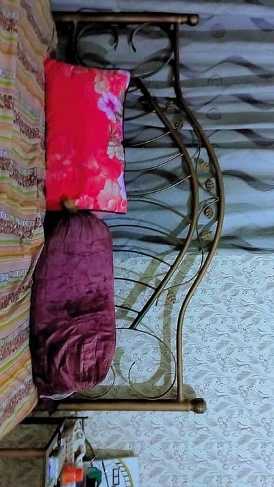 iron bed with two side tables