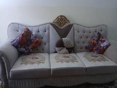 5 seater sofa with table along with 4 stools for sale