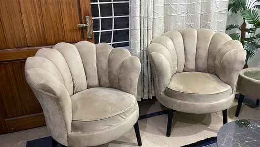2 seater coffee chairs with a table