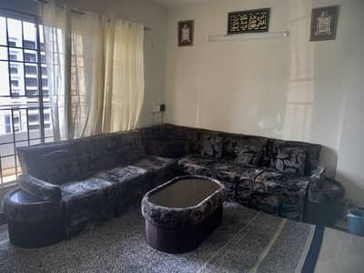 06 seater sofa seat with tables and pillows.