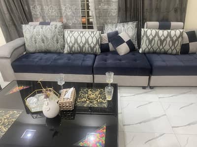 9 seater L shape sofa almost new