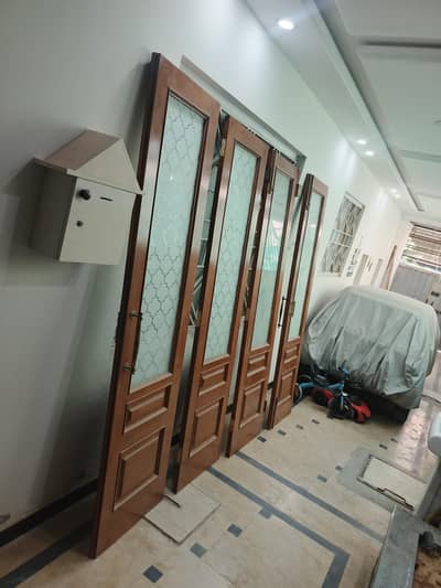 folding solid doors imported yellow pine wood in excellent condition.