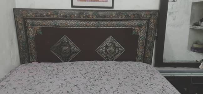 bed with dressing table and cupboard