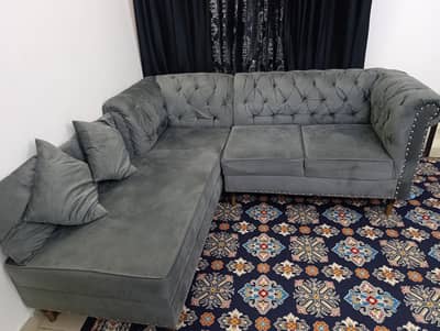 Elegant Dark Gray L-Shape Sofa with Tufted Back & Stud Detailing