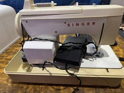 Singer  Machine urgent sale .