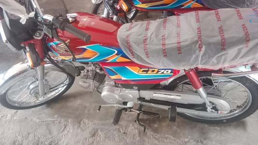 Honda CD 70 only 1 week used mileage 1021 red colour