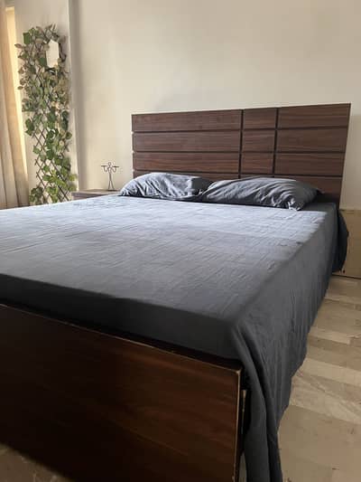 queen size bed and dressing with side table