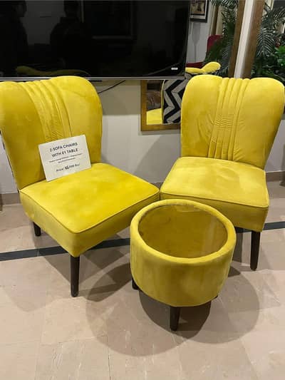 Modern yellow 2-sofa chairs with matching coffee table