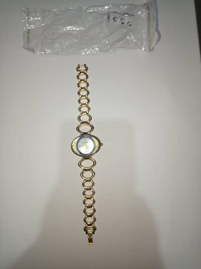 Elegant gold tone ladies bracelete watch oval dial