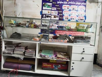 mobile and stationary and sport good with counter and rack and machine