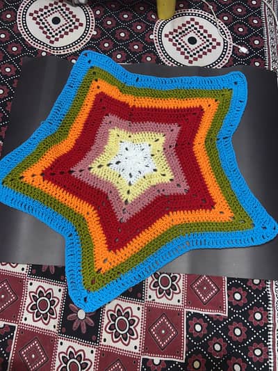 Handmade crocheted star table mat