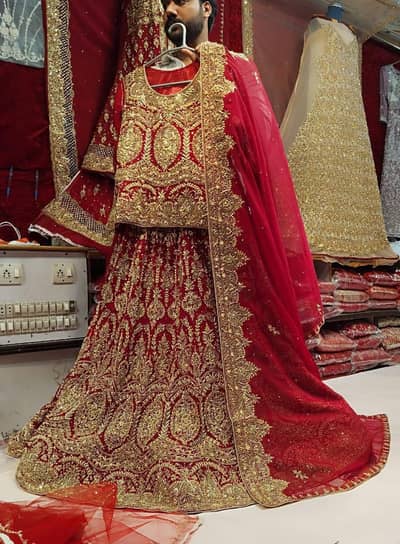 Luxury Red Bridal lehnga. . tail lehnga with shirt for sale
