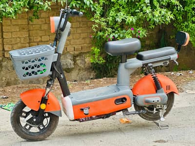 electric scooter 50km range orange good condition 48V electric bike