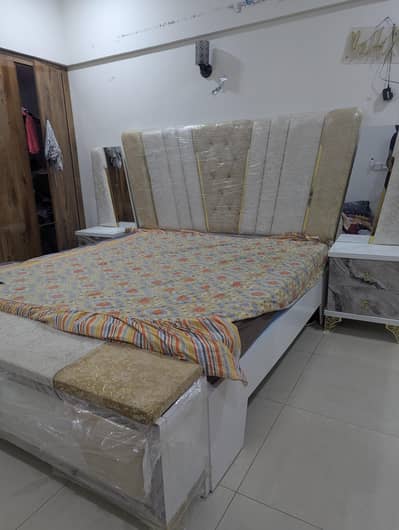 king size bed with dressing table and side table
