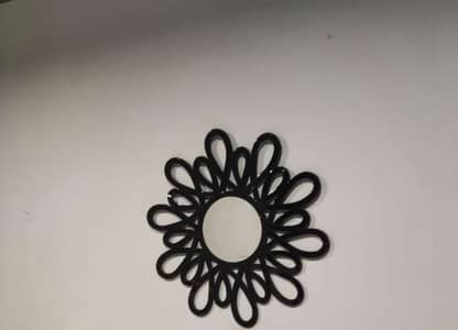 Round mirror with wooden floral design