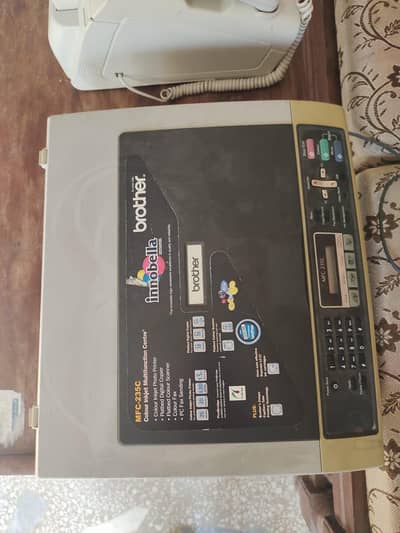printer and scanner and faxer and telephone and photo copy masheen