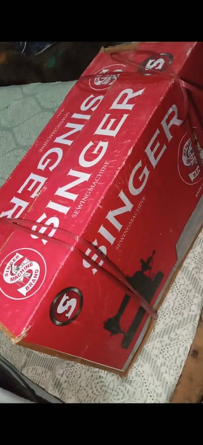 Singeng machine bilkul box pack hai