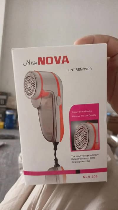 Nova lint remover Ac220V compact white orange: