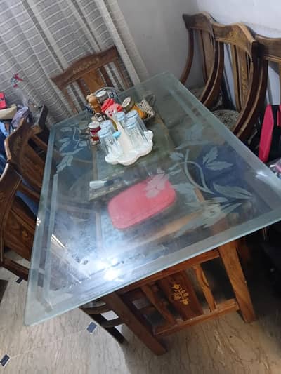 Used 6 Seater Russian Partal wooden dining table with glasstop.