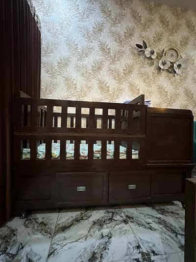 Baby cot/crib with 8 cabinets and tyres