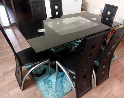 Glass top dining table with dining chairs