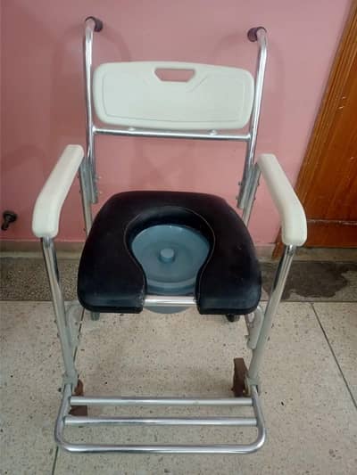 adjustable commode chair with wheels and soft padded seat