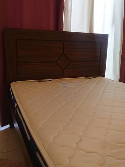 bed with side table and mattress
