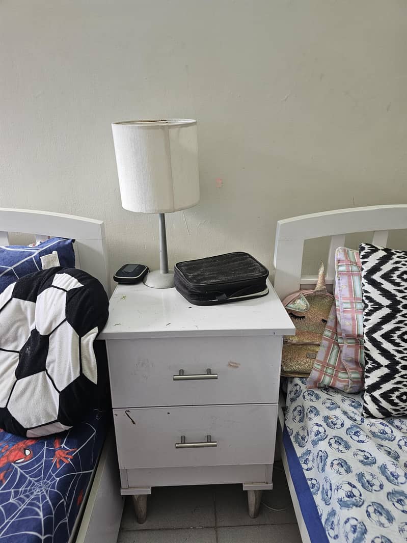 2 single beds and side table 0