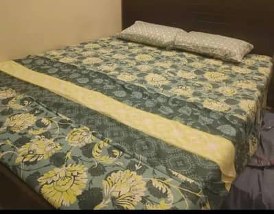 double bed with two side tables
